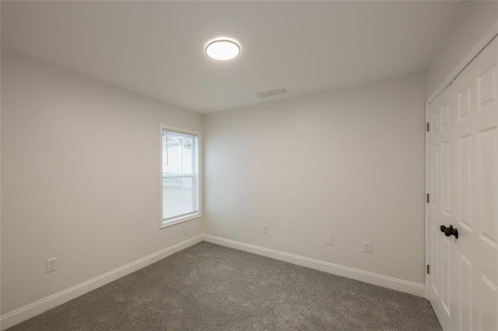 2027 Lois Place Northwest, Unit A Atlanta, GA 30318 - Photo 19 of 23 an empty room with windows
