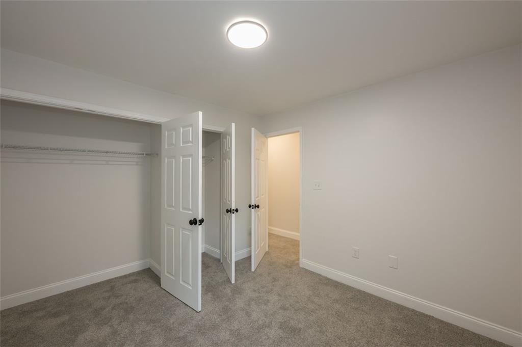 2027 Lois Place Northwest, Unit A Atlanta, GA 30318 - Photo 20 of 23 an empty room with an entryway