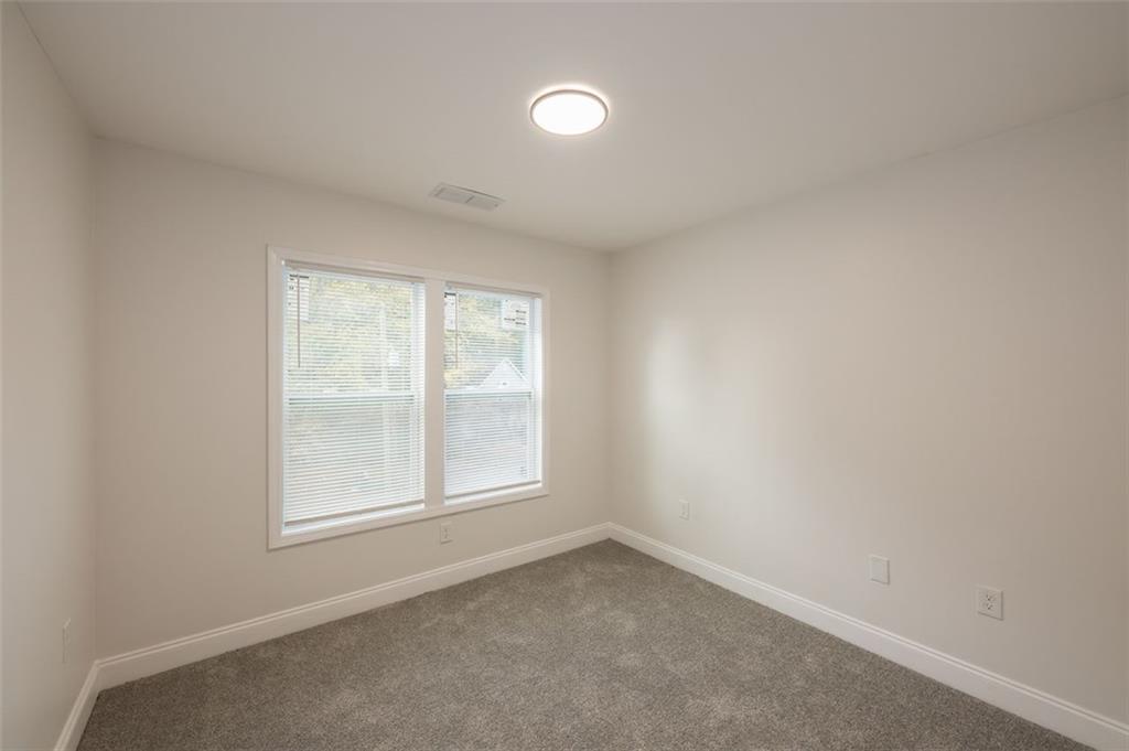 2027 Lois Place Northwest, Unit A Atlanta, GA 30318 - Photo 22 of 23 an empty room with a window