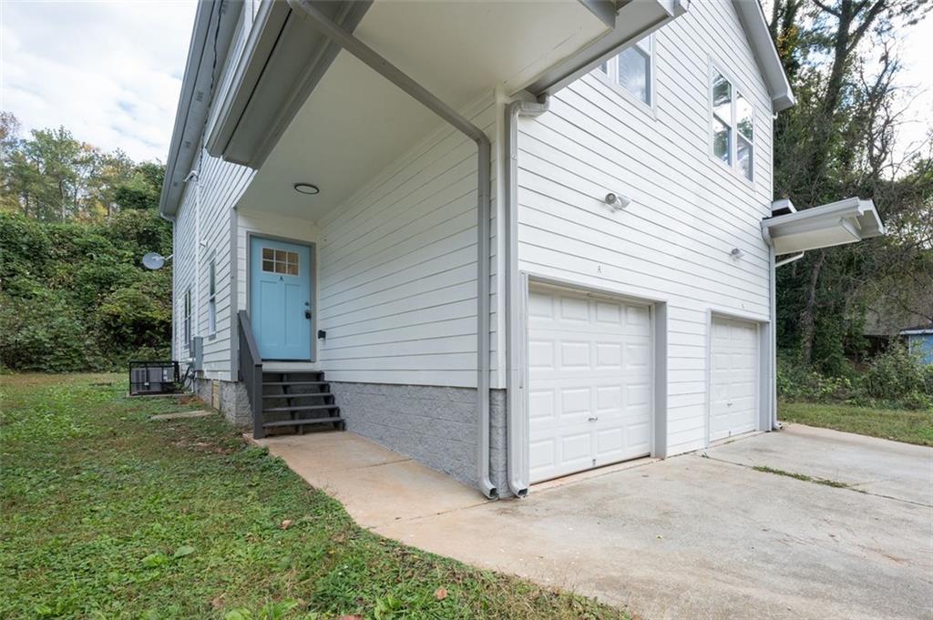 2027 Lois Place Northwest, Unit A Atlanta, GA 30318 - Photo 3 of 23 a view of a front of house with a yard