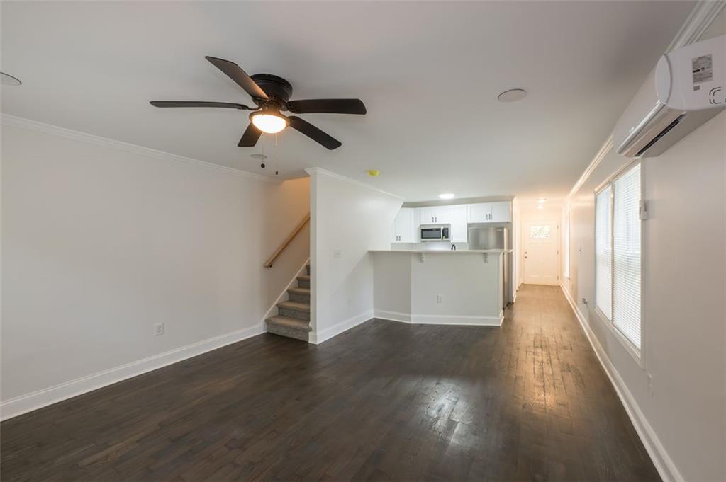 2027 Lois Place Northwest, Unit A Atlanta, GA 30318 - Photo 4 of 23 a view of empty room with wooden floor and window