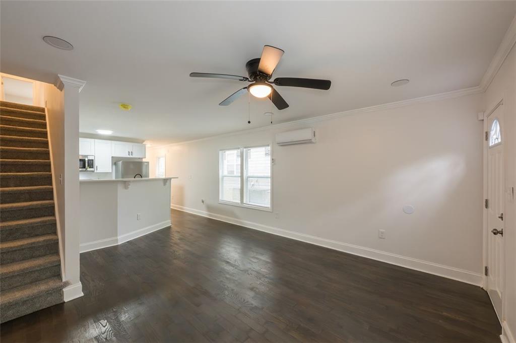 2027 Lois Place Northwest, Unit A Atlanta, GA 30318 - Photo 5 of 23 a view of a kitchen with wooden floor and a sink