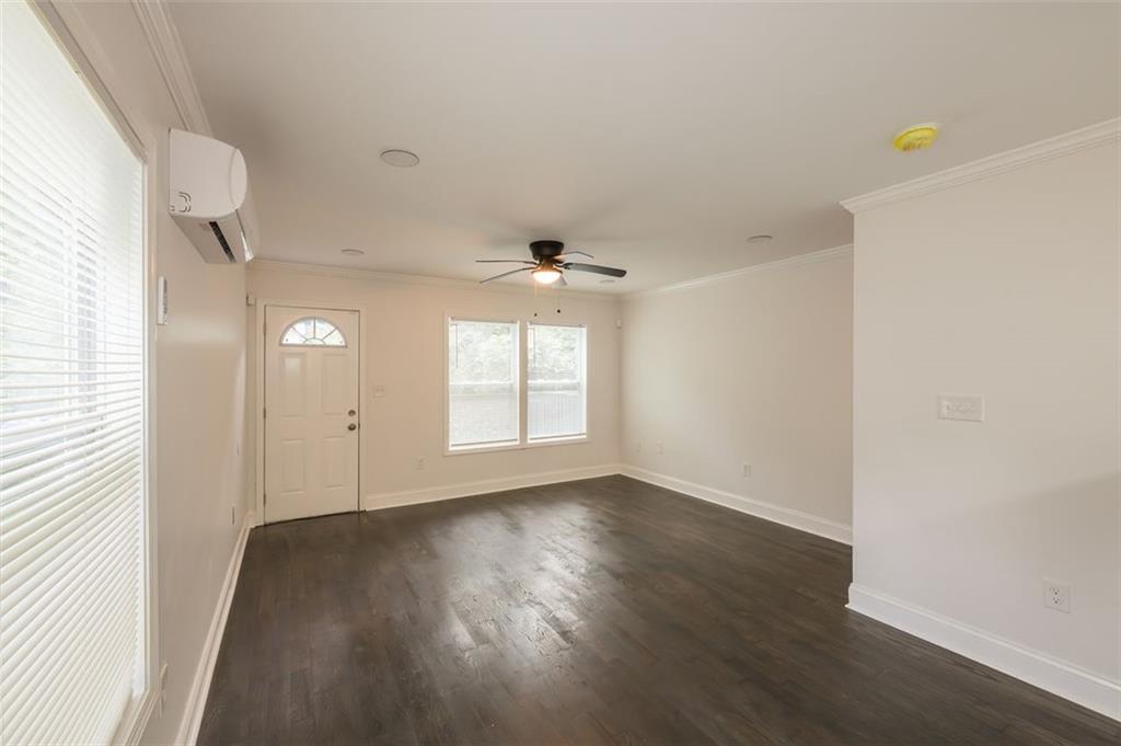 2027 Lois Place Northwest, Unit A Atlanta, GA 30318 - Photo 7 of 23 an empty room with wooden floor and windows