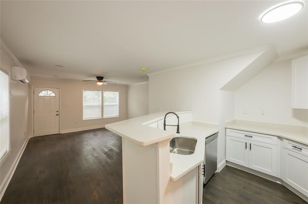 2027 Lois Place Northwest, Unit A Atlanta, GA 30318 - Photo 9 of 23 a kitchen with a sink and cabinets