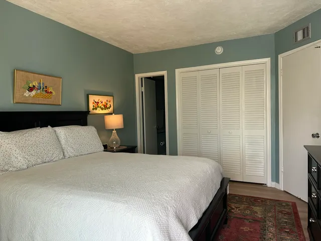 a white toilet sitting next to a bathroom sink