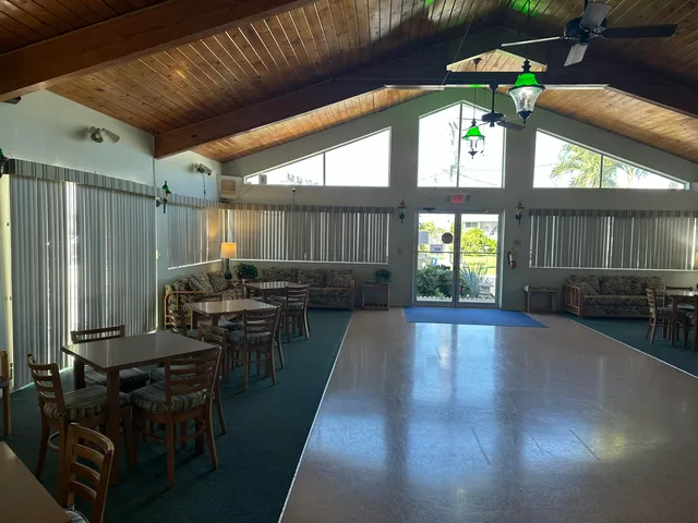 a view of a house with pool and a yard