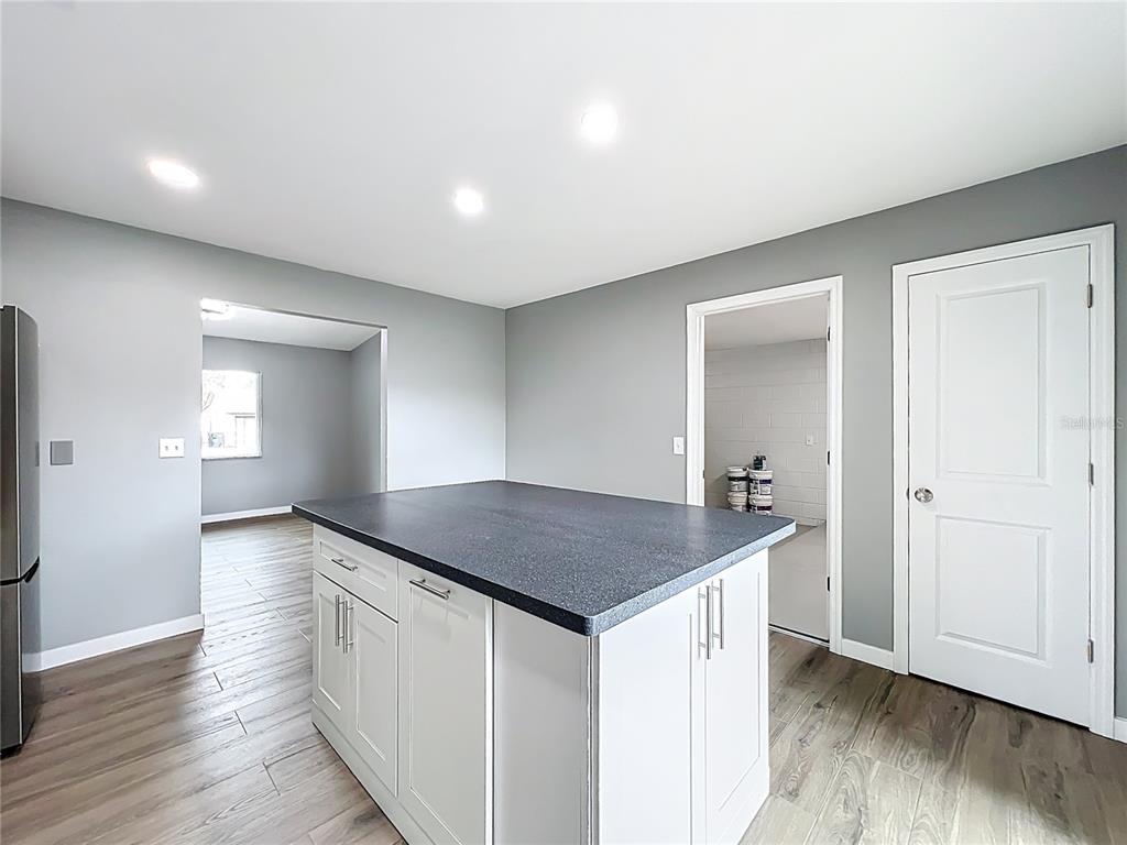 6848 Compass Court Orlando, FL 32810 - Photo 16 of 47 a kitchen with a sink and cabinets