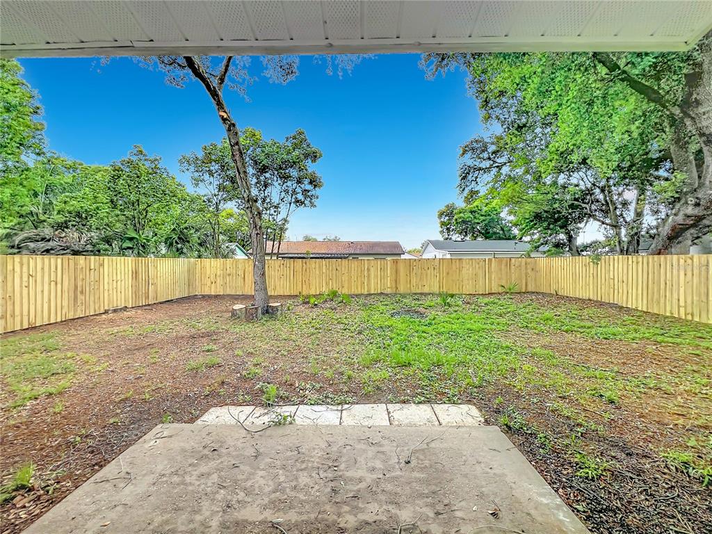 6848 Compass Court Orlando, FL 32810 - Photo 26 of 47 a view of a backyard