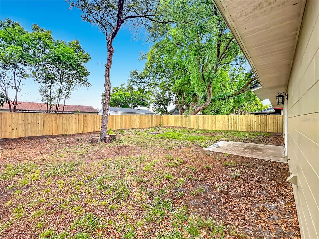 6848 Compass Court Orlando, FL 32810 - Photo 27 of 47 a view of a backyard