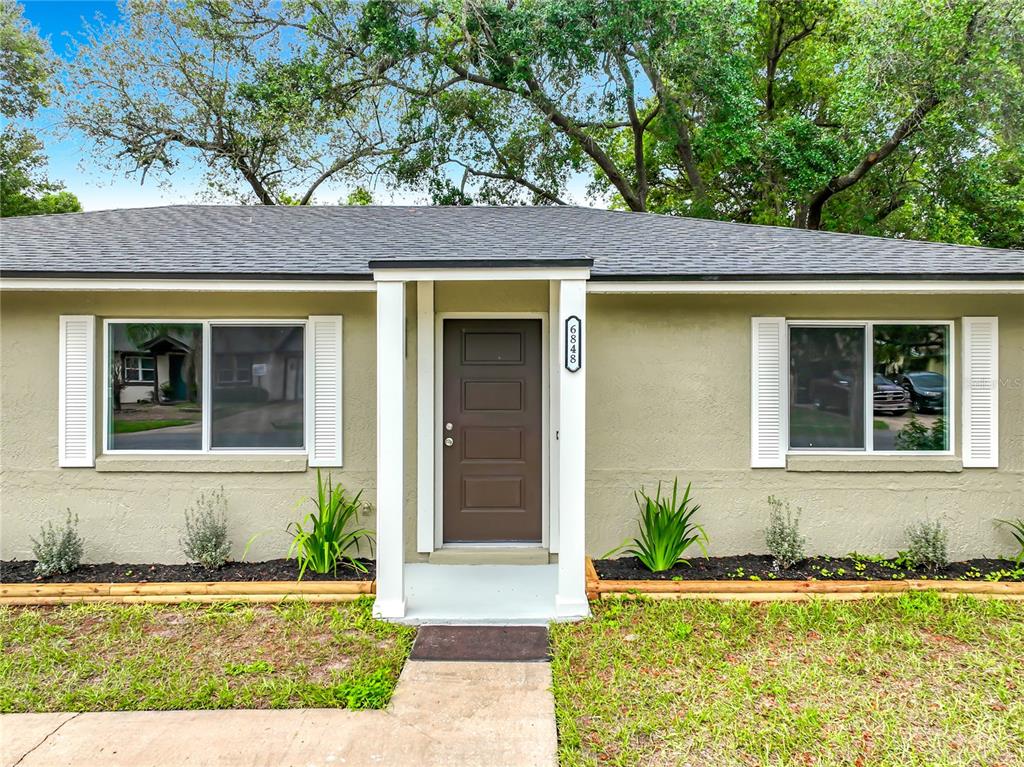 6848 Compass Court Orlando, FL 32810 - Photo 28 of 47 front view of a house