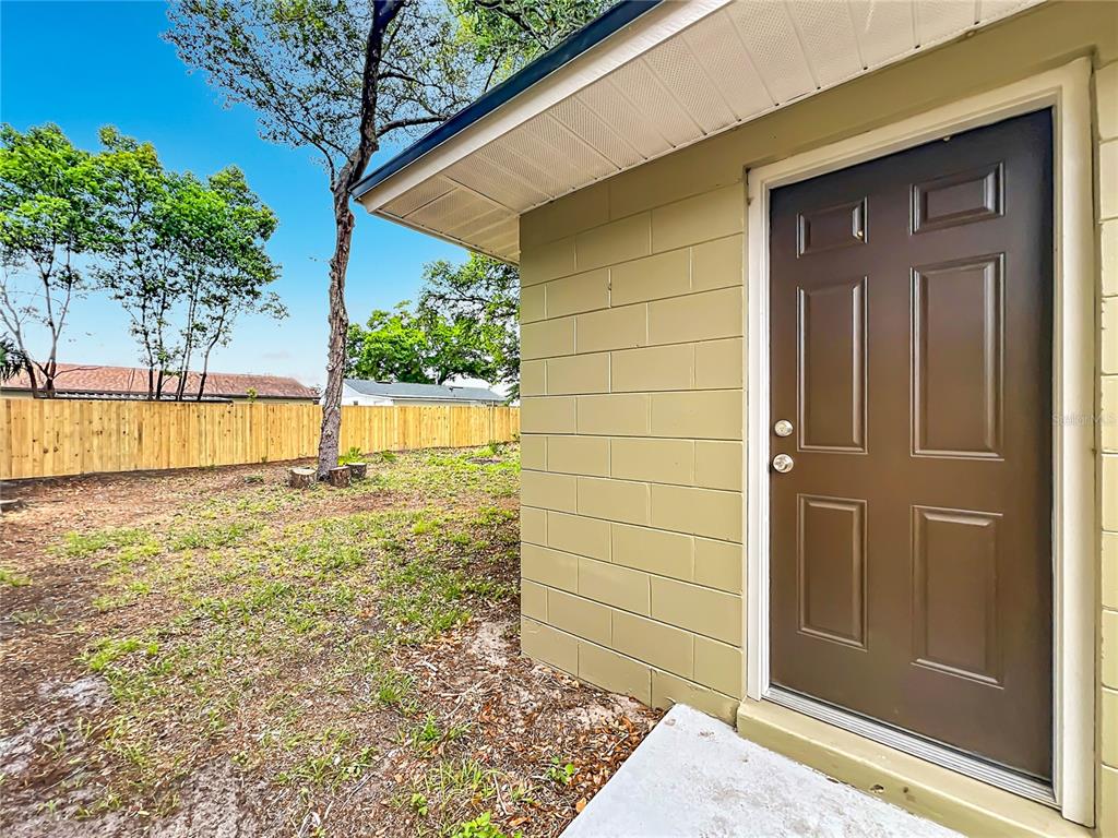 6848 Compass Court Orlando, FL 32810 - Photo 29 of 47 a view of back yard of the house
