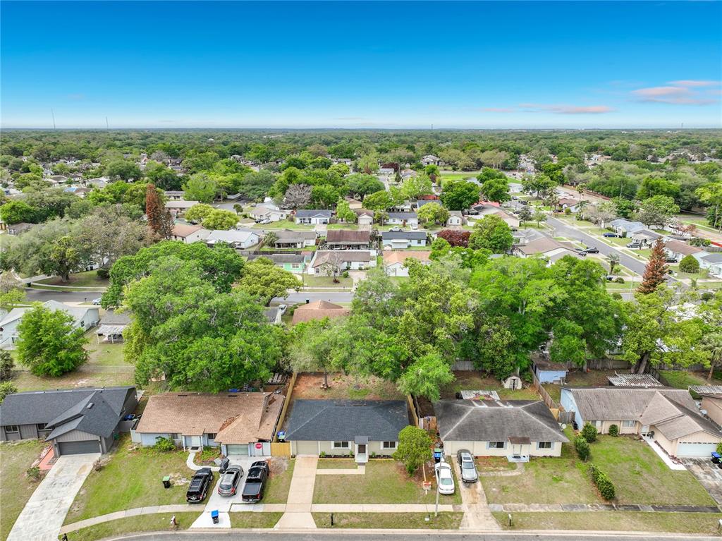 6848 Compass Court Orlando, FL 32810 - Photo 31 of 47 an aerial view of residential houses with outdoor space