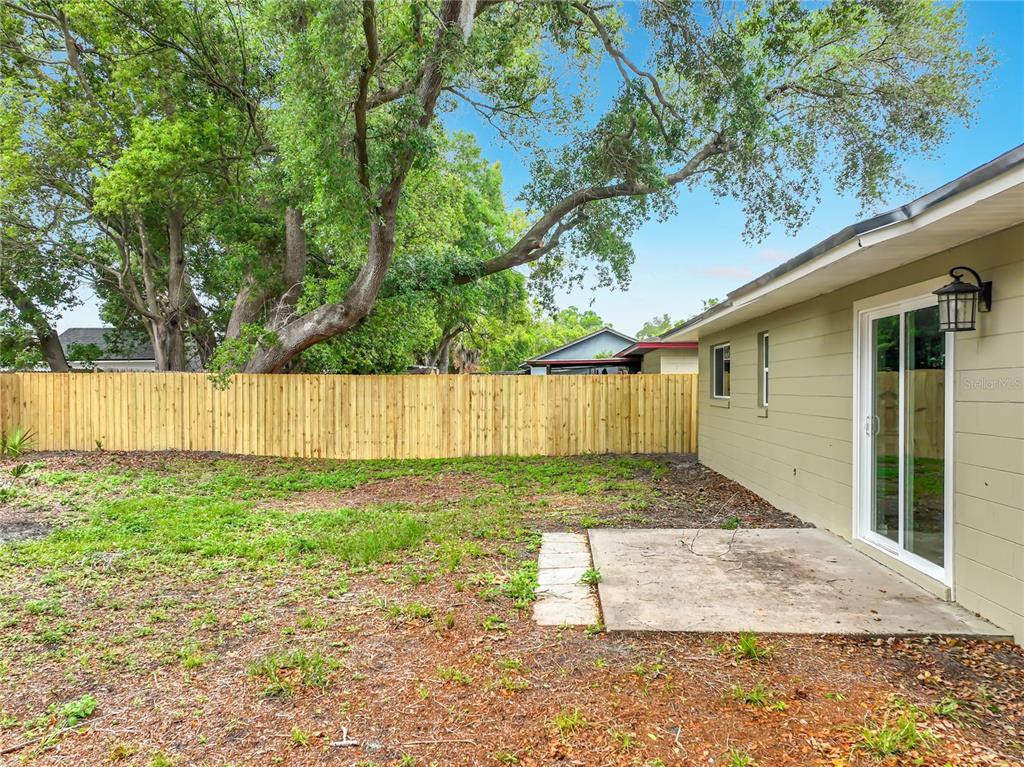 6848 Compass Court Orlando, FL 32810 - Photo 33 of 47 a view of a backyard