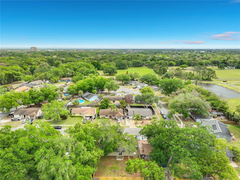 6848 Compass Court Orlando, FL 32810 - Photo 42 of 47 an aerial view of residential houses with city view