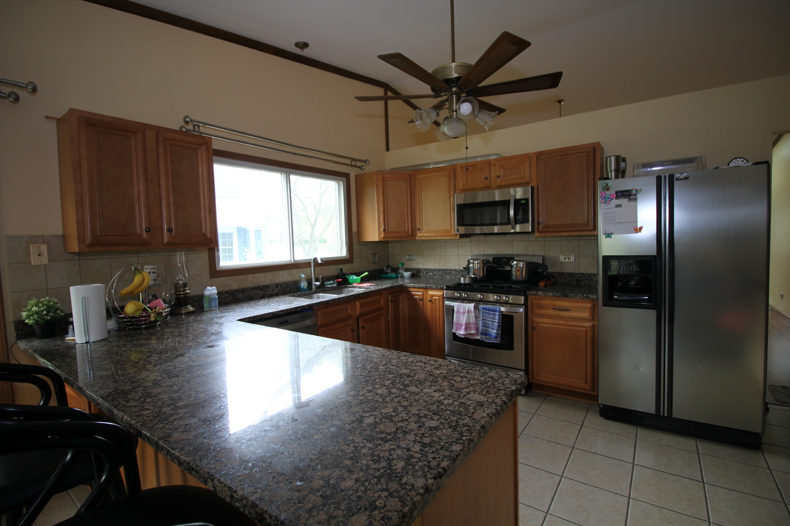 1925 Lisson Road Naperville, IL 60565 - Photo 2 of 18 a kitchen with granite countertop a stove sink and cabinets