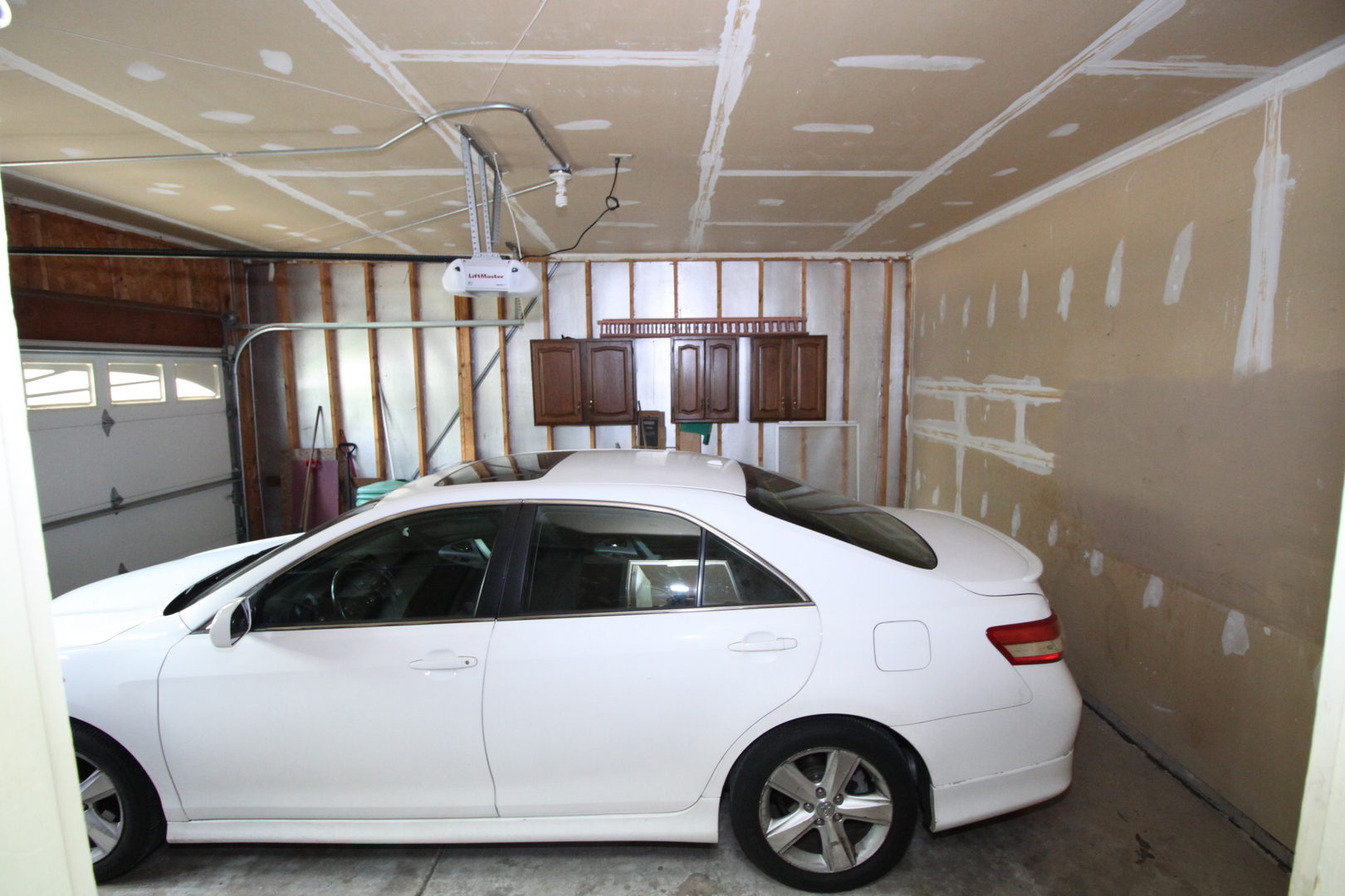 1925 Lisson Road Naperville, IL 60565 - Photo 18 of 18 a car parked in a garage