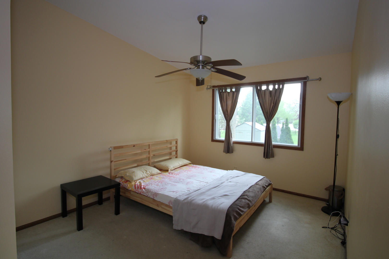 1925 Lisson Road Naperville, IL 60565 - Photo 10 of 18 a bedroom with a bed a window and a chandelier