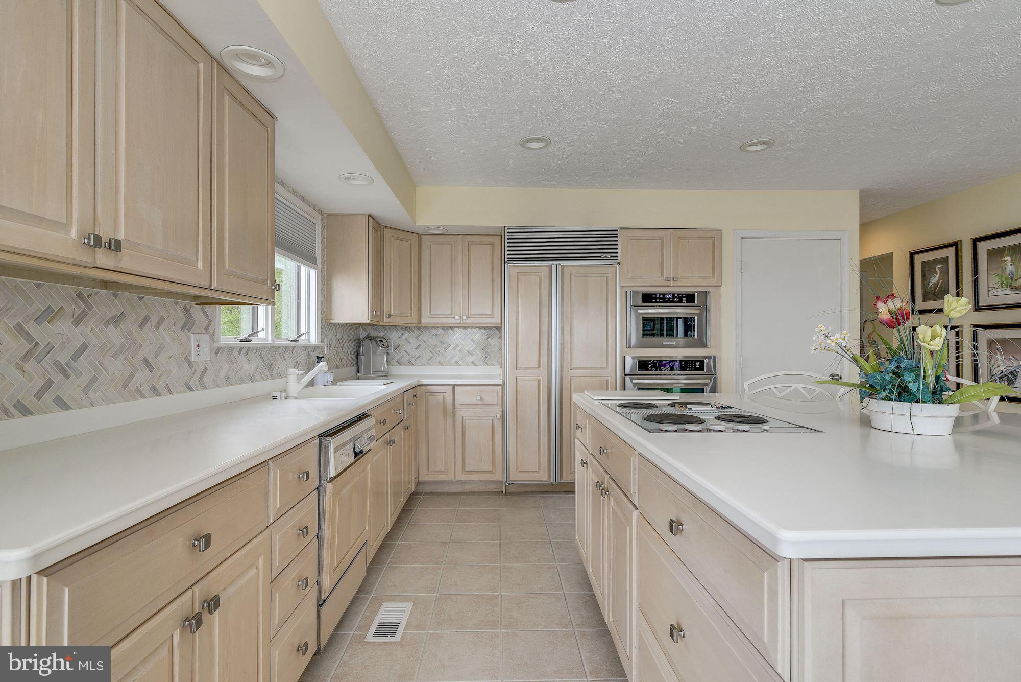2133 Beach Haven Road Annapolis, MD 21409 - Photo 17 of 40 Neutral Cabinets and Herring Bone Back Splash