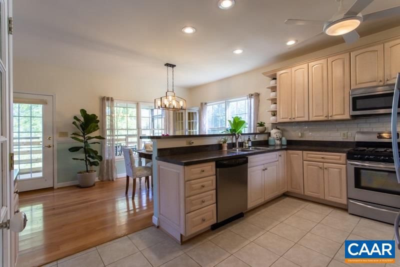 2637 Bybees Church Road Palmyra, VA 22963 - Photo 14 of 50 a kitchen with stainless steel appliances granite countertop a stove sink and cabinets