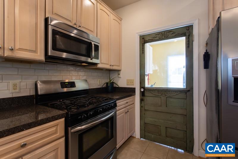 2637 Bybees Church Road Palmyra, VA 22963 - Photo 16 of 50 a kitchen with stainless steel appliances granite countertop a stove microwave and sink