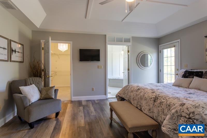 2637 Bybees Church Road Palmyra, VA 22963 - Photo 23 of 50 a bedroom with a bed and a television