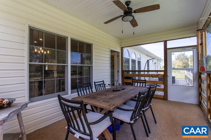 2637 Bybees Church Road Palmyra, VA 22963 - Photo 10 of 50 a view of a dining room with furniture window and wooden floor