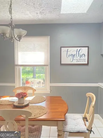 a view of table and chair in the room