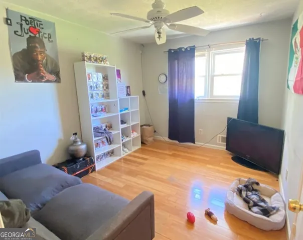 a view of a dining room with furniture and window