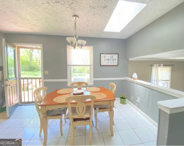 a view of a backyard with sitting area and furniture
