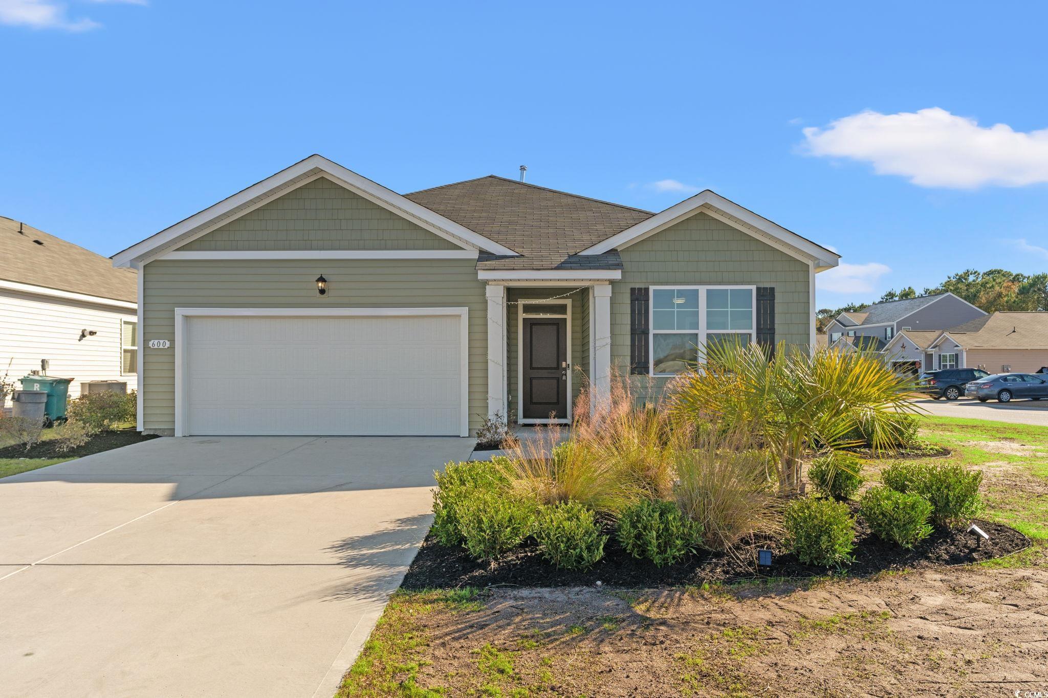 600 Table Rock Court Myrtle Beach, SC 29579 - Photo 1 of 37 View of front of house with driveway and an attached garage