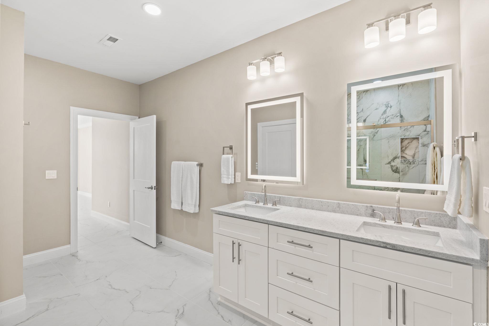 600 Table Rock Court Myrtle Beach, SC 29579 - Photo 21 of 37 Bathroom featuring double vanity, light marble finish flooring, a marble finish shower, and recessed lighting