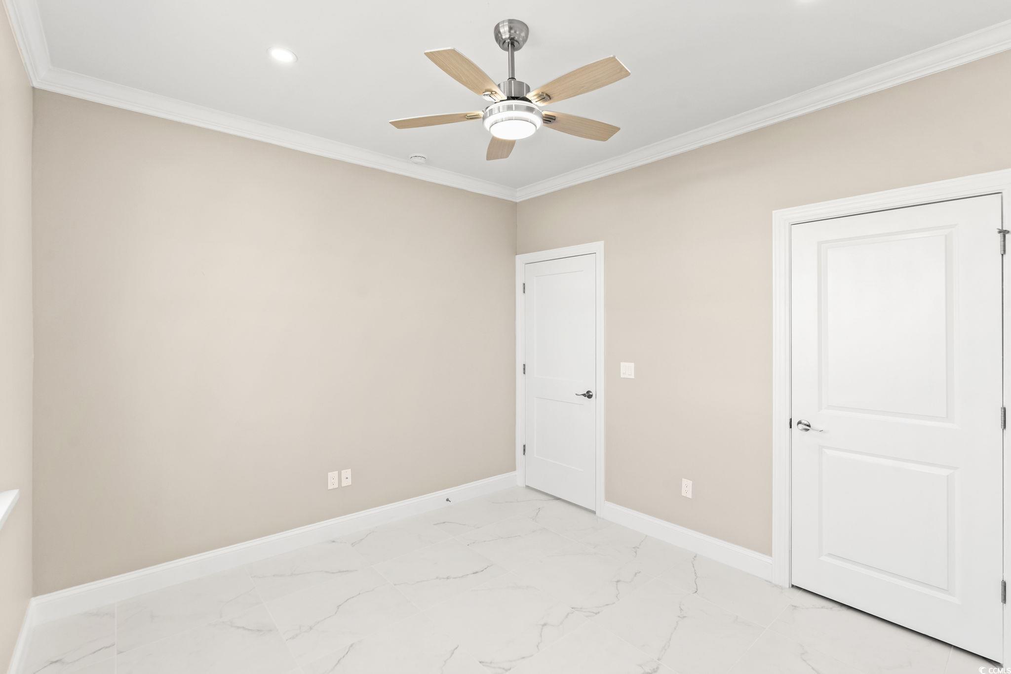 600 Table Rock Court Myrtle Beach, SC 29579 - Photo 23 of 37 Unfurnished bedroom with crown molding, a ceiling fan, light marble finish floors, and recessed lighting