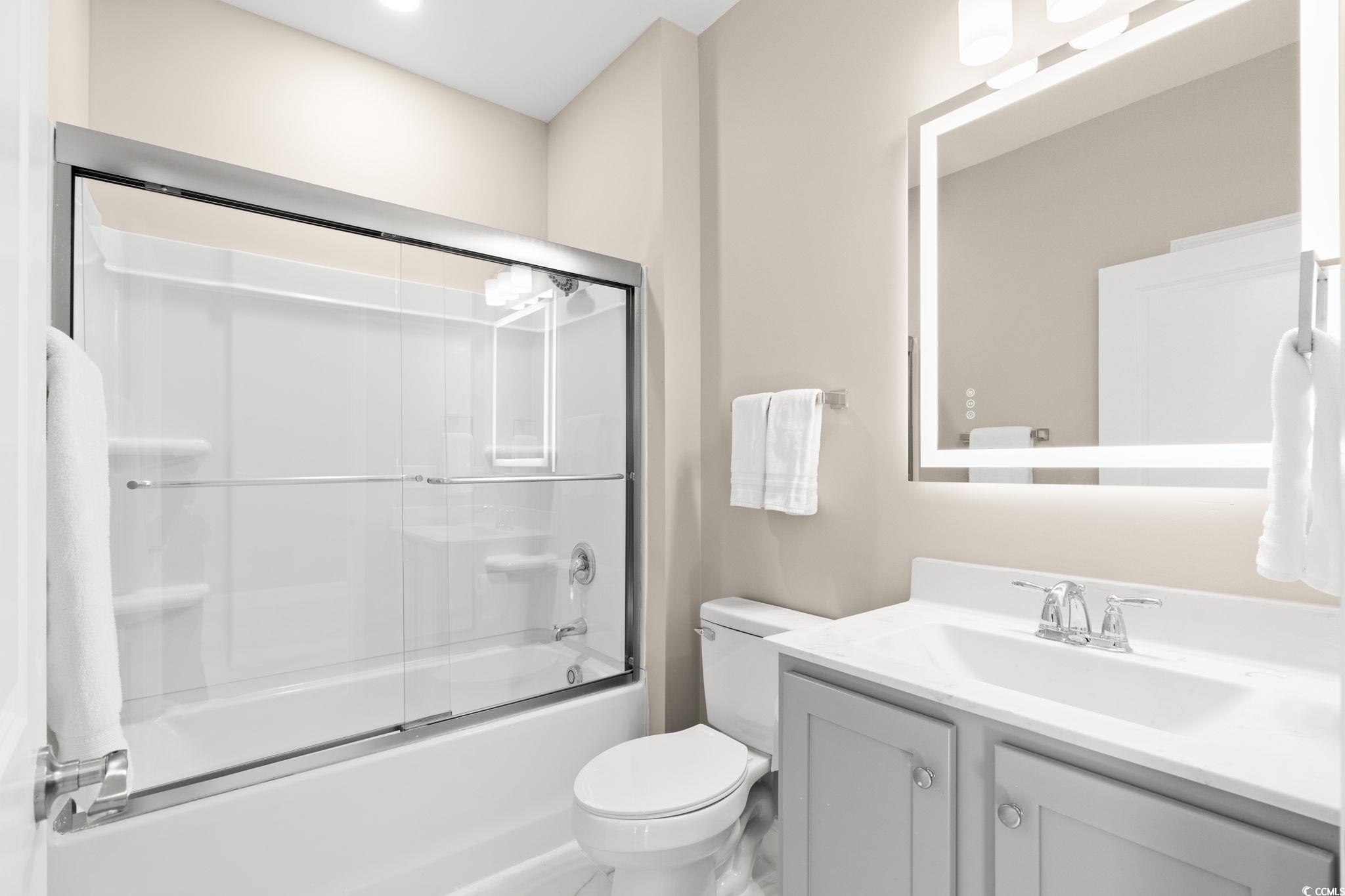 600 Table Rock Court Myrtle Beach, SC 29579 - Photo 24 of 37 Full bath featuring shower / bath combination with glass door and vanity