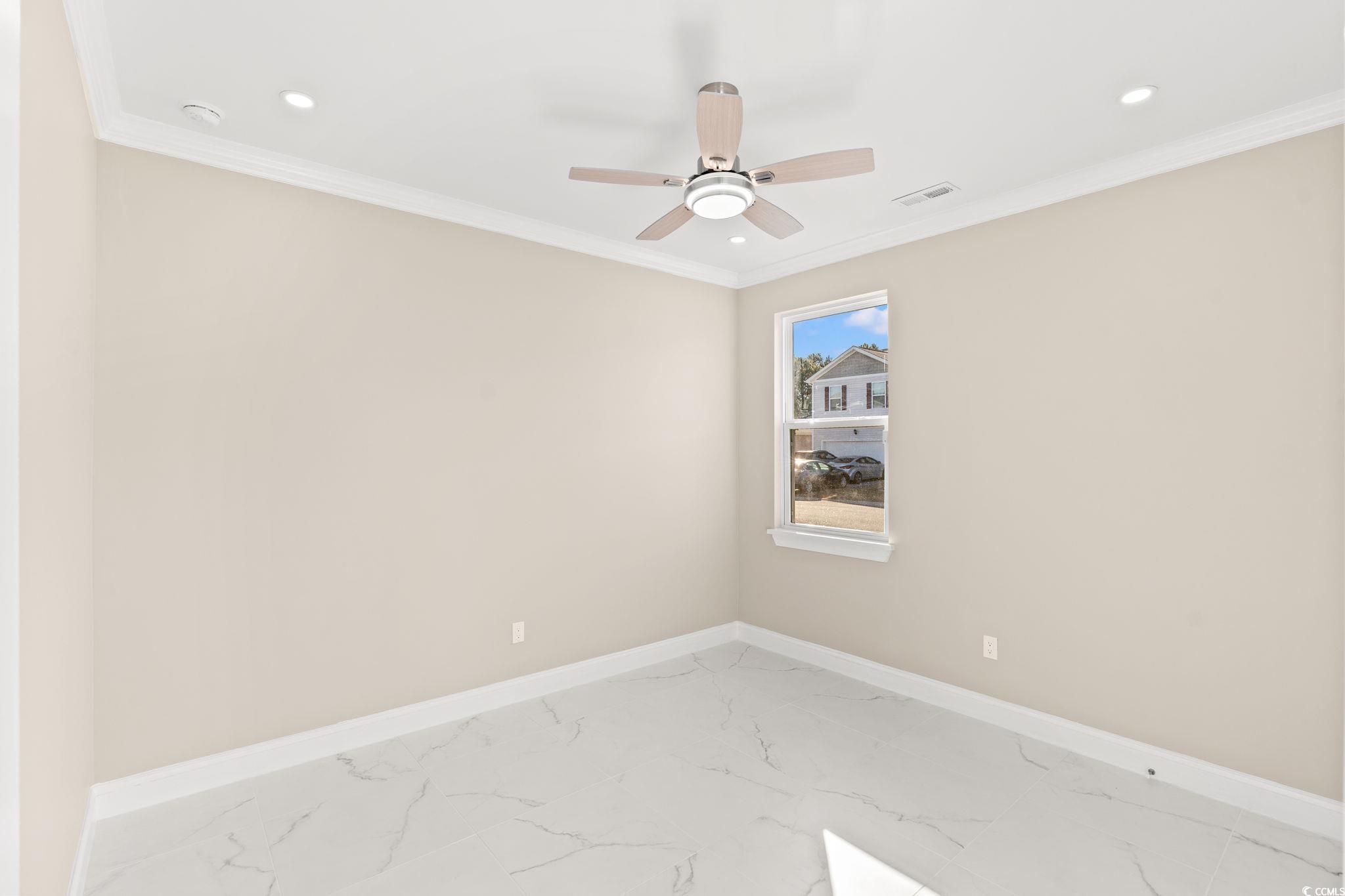 600 Table Rock Court Myrtle Beach, SC 29579 - Photo 25 of 37 Empty room with marble finish flooring, crown molding, a ceiling fan, and recessed lighting