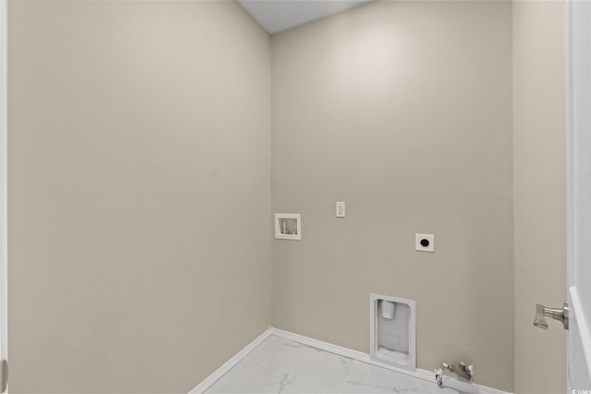 600 Table Rock Court Myrtle Beach, SC 29579 - Photo 27 of 37 Washroom featuring light marble finish floors, washer hookup, and hookup for an electric dryer