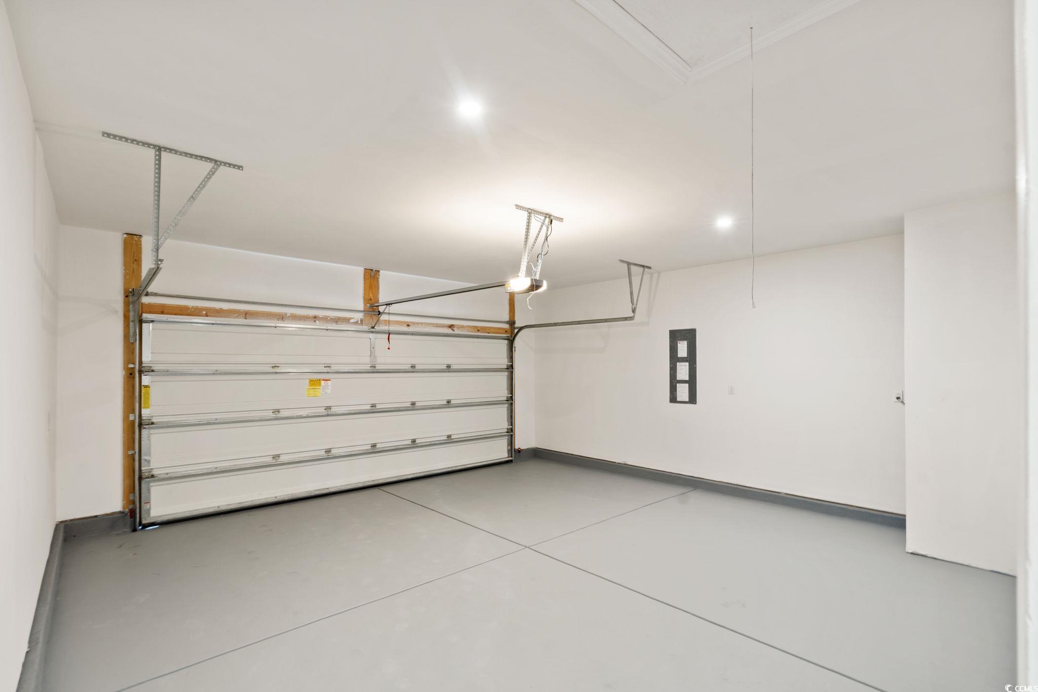 600 Table Rock Court Myrtle Beach, SC 29579 - Photo 28 of 37 Garage with baseboards and electric panel