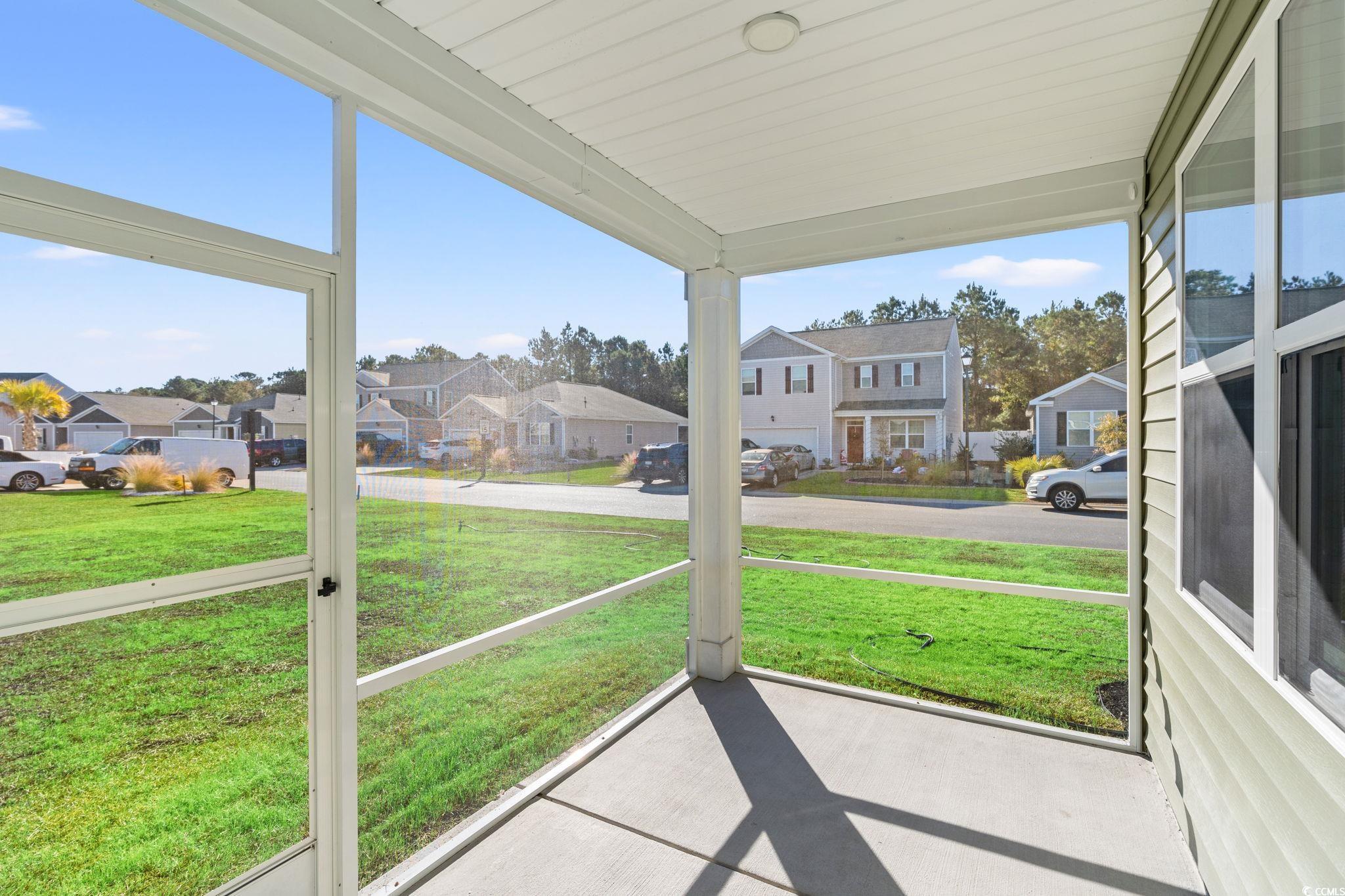 600 Table Rock Court Myrtle Beach, SC 29579 - Photo 29 of 37 Unfurnished sunroom featuring a residential view and a porch