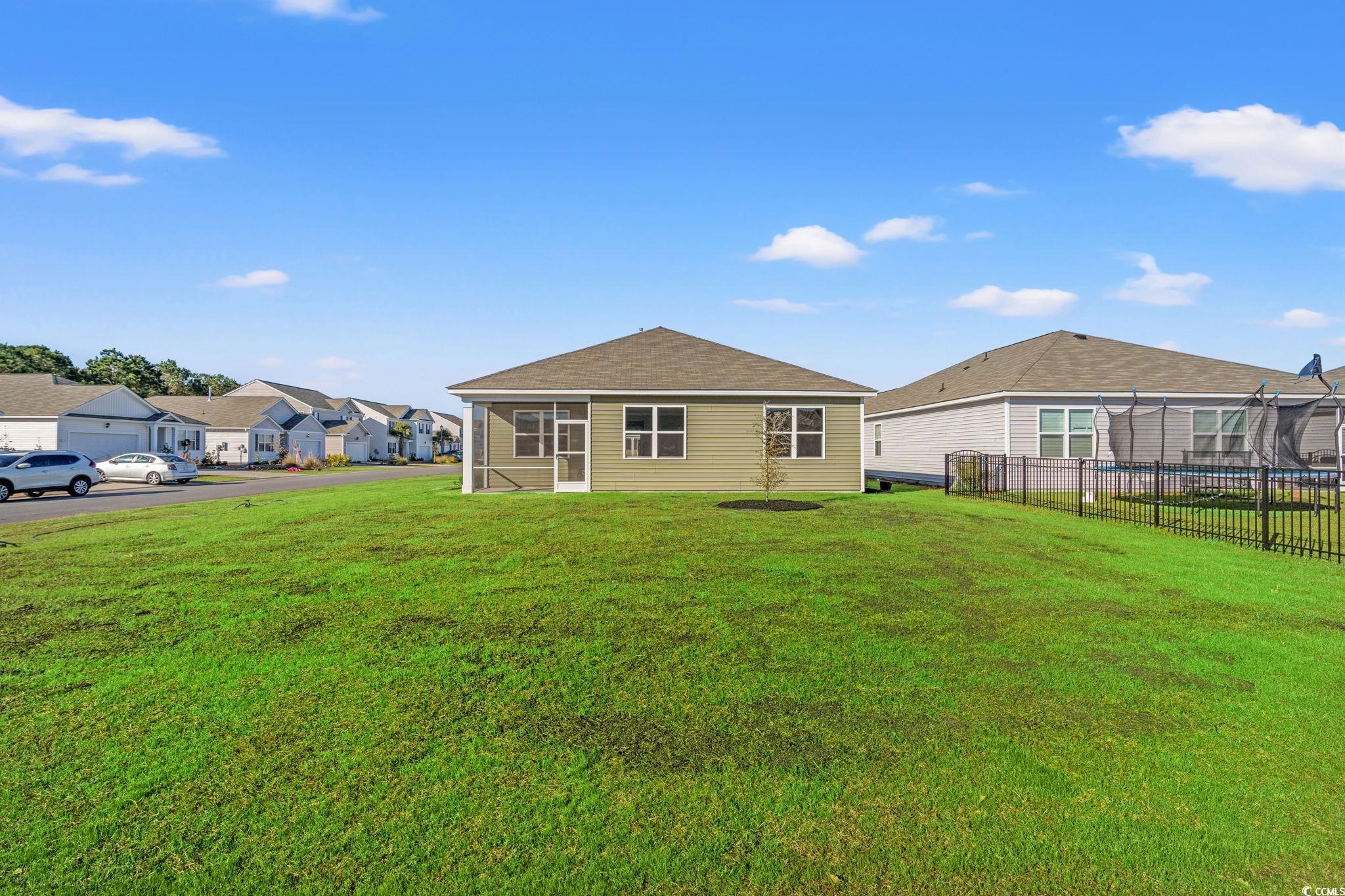 600 Table Rock Court Myrtle Beach, SC 29579 - Photo 30 of 37 Rear view of house with a sunroom and a residential view