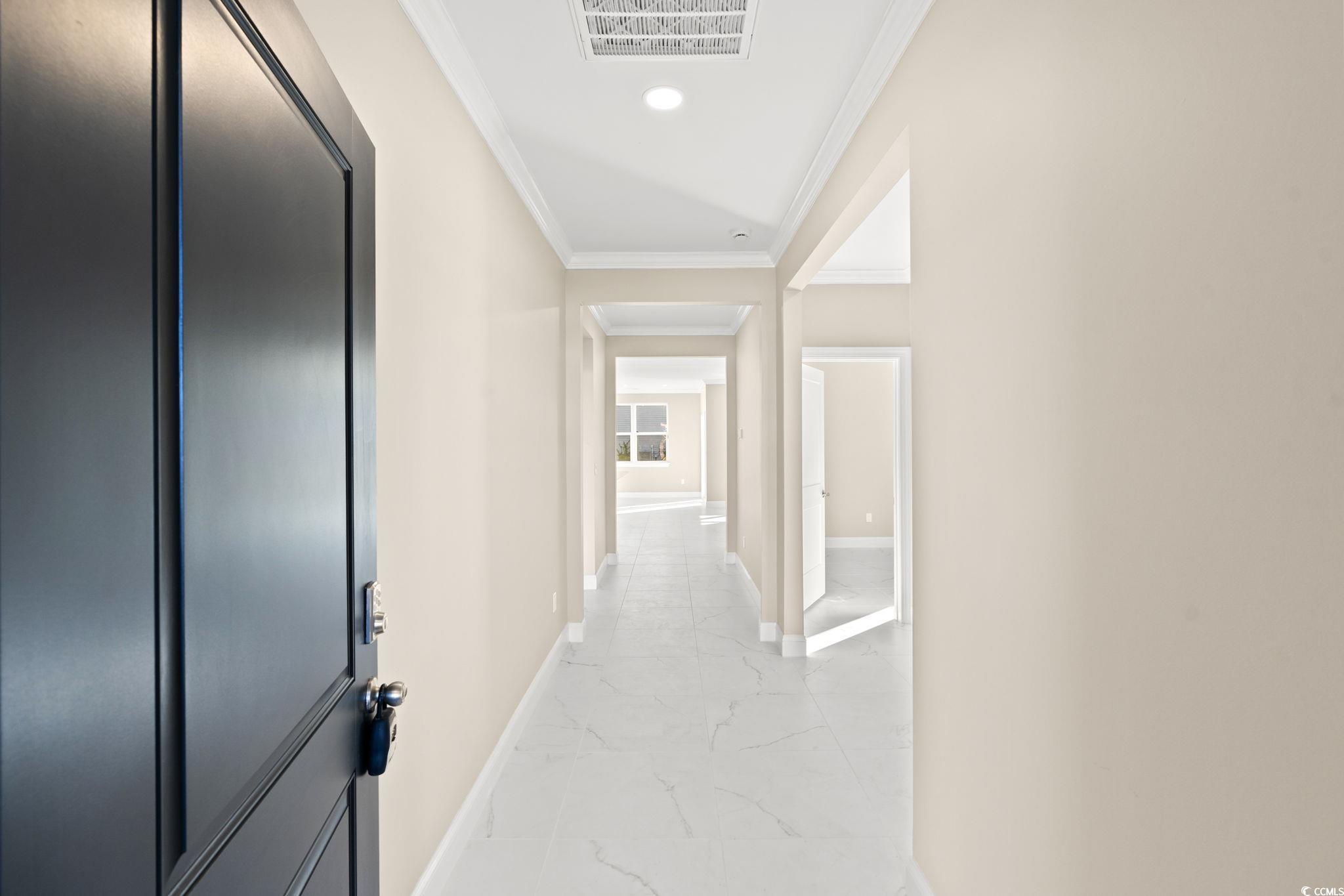 600 Table Rock Court Myrtle Beach, SC 29579 - Photo 5 of 37 Corridor featuring ornamental molding, light marble finish floors, and recessed lighting
