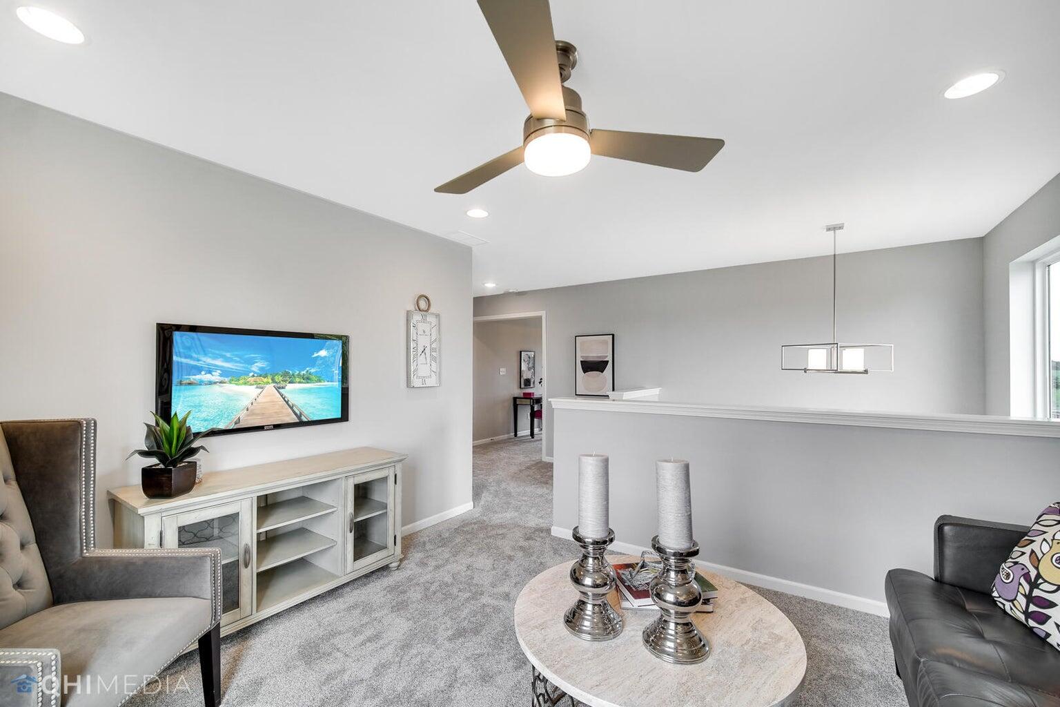 2845 East 105th Avenue Crown Point, IN 46307 - Photo 5 of 24 a bathroom with a sink a mirror and a potted plant