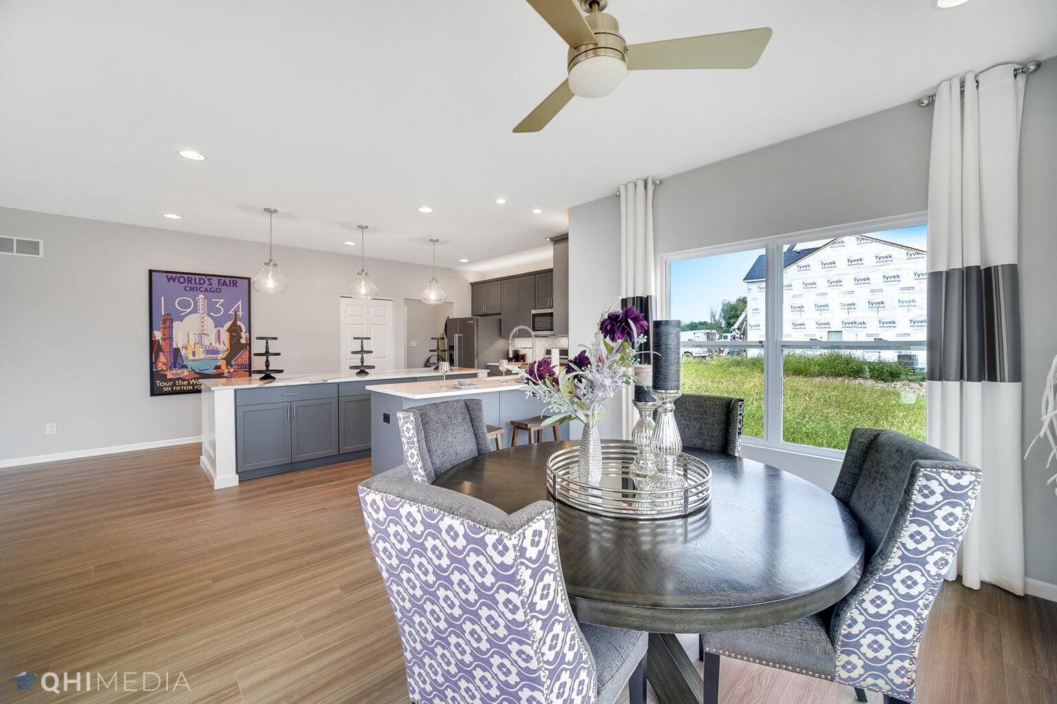 2845 East 105th Avenue Crown Point, IN 46307 - Photo 6 of 24 a view of a dining room with furniture window and wooden floor