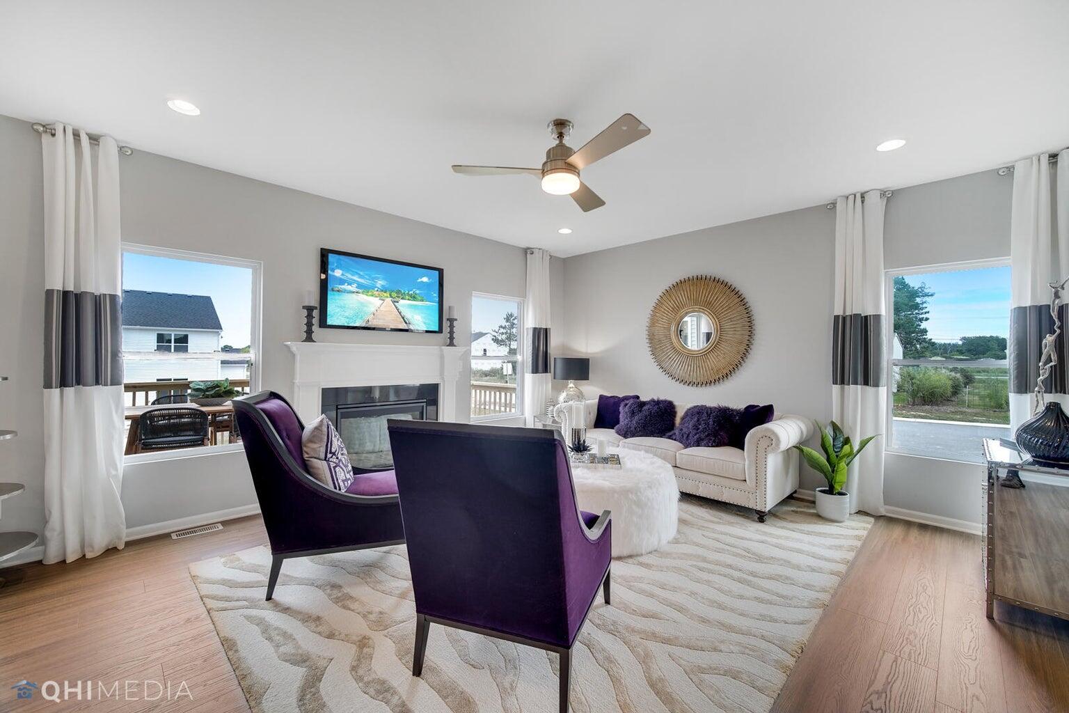 2845 East 105th Avenue Crown Point, IN 46307 - Photo 8 of 24 a living room with fireplace furniture and a wooden floor
