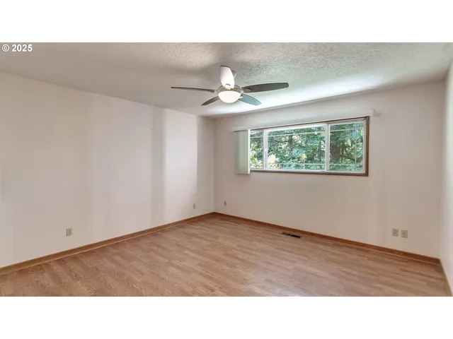 a bathroom with a sink double vanity granite and a shower