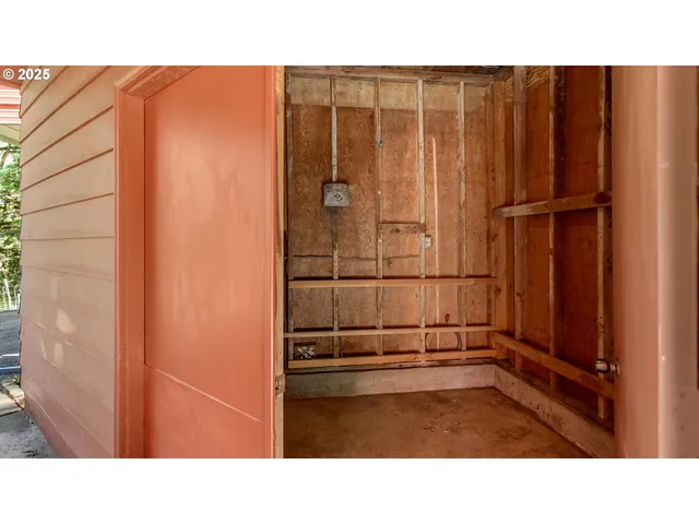 a backyard of a house with plants and outdoor seating