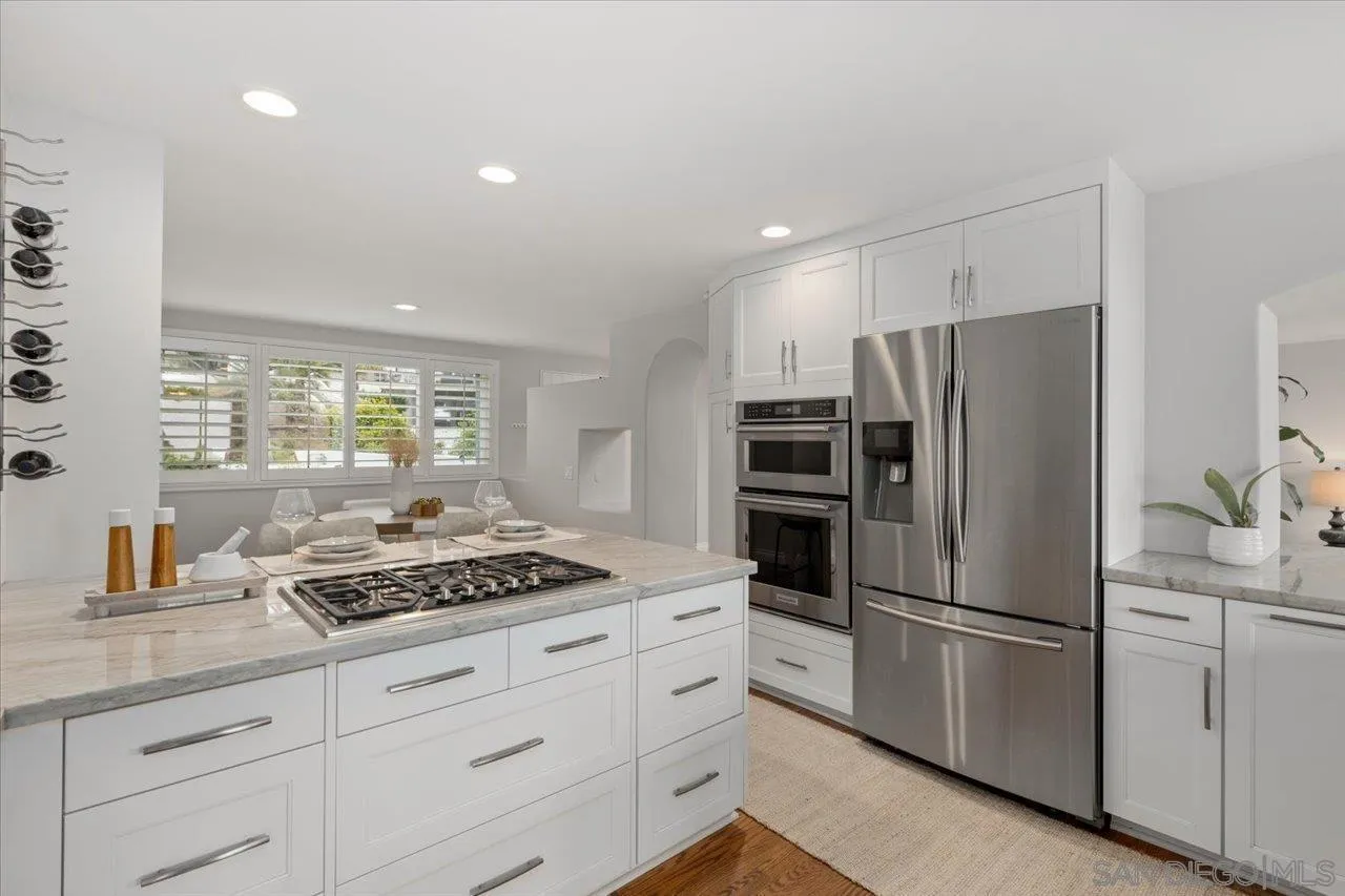 13726 Pine Needles Drive Del Mar, CA 92014 - Photo 23 of 70 a kitchen with appliances a refrigerator and window