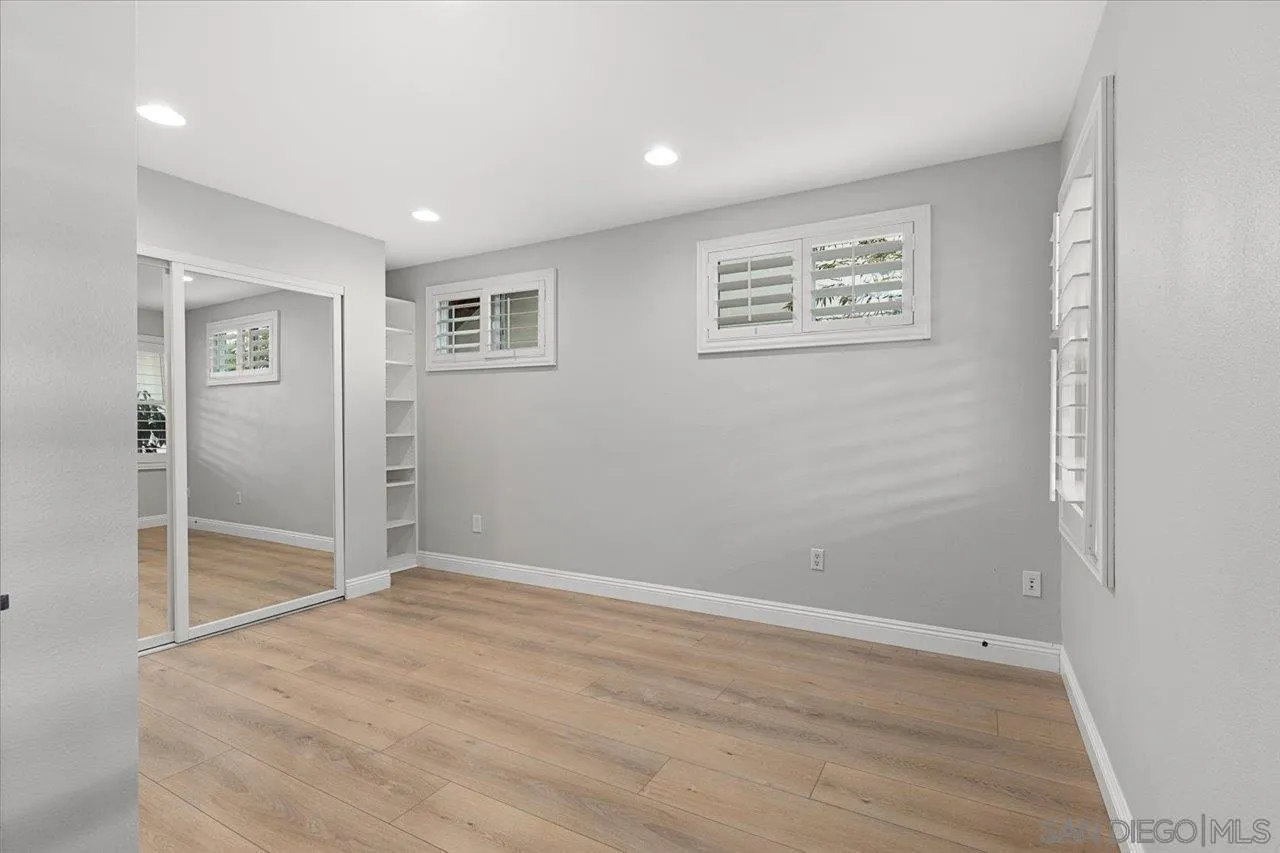 13726 Pine Needles Drive Del Mar, CA 92014 - Photo 40 of 70 a view of an empty room with wooden floor and a window