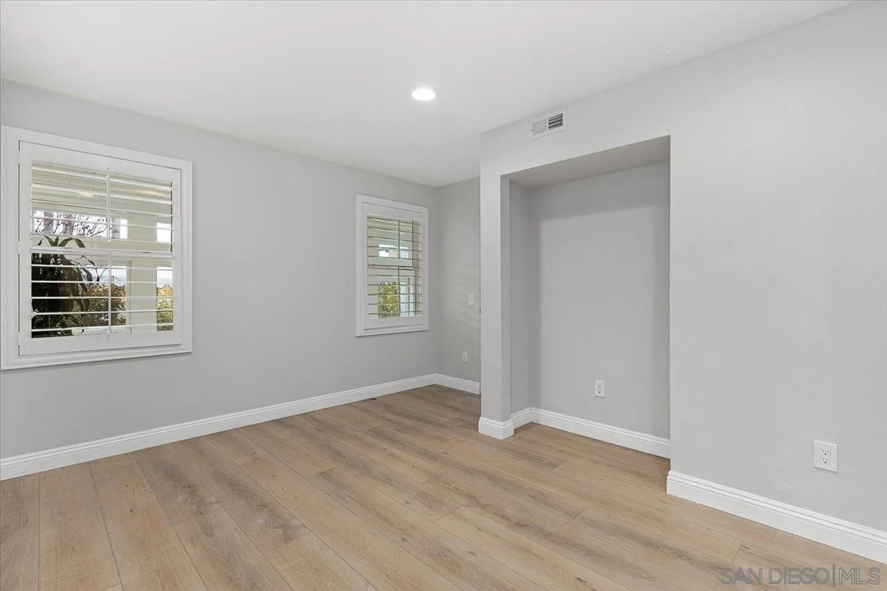 13726 Pine Needles Drive Del Mar, CA 92014 - Photo 41 of 70 a view of an empty room with wooden floor and a window