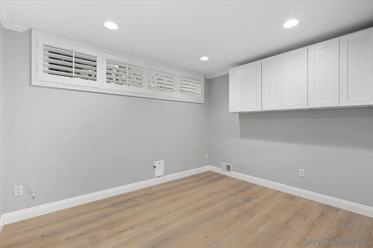 13726 Pine Needles Drive Del Mar, CA 92014 - Photo 43 of 70 a view of a kitchen with wooden floor and cabinets