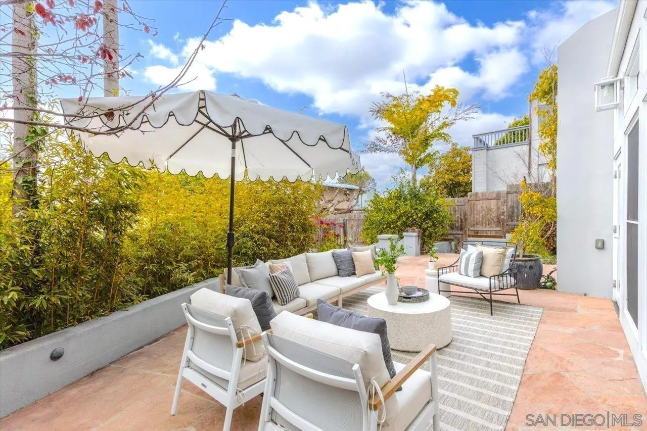 13726 Pine Needles Drive Del Mar, CA 92014 - Photo 52 of 70 a view of a patio with couches table and chairs and potted plants