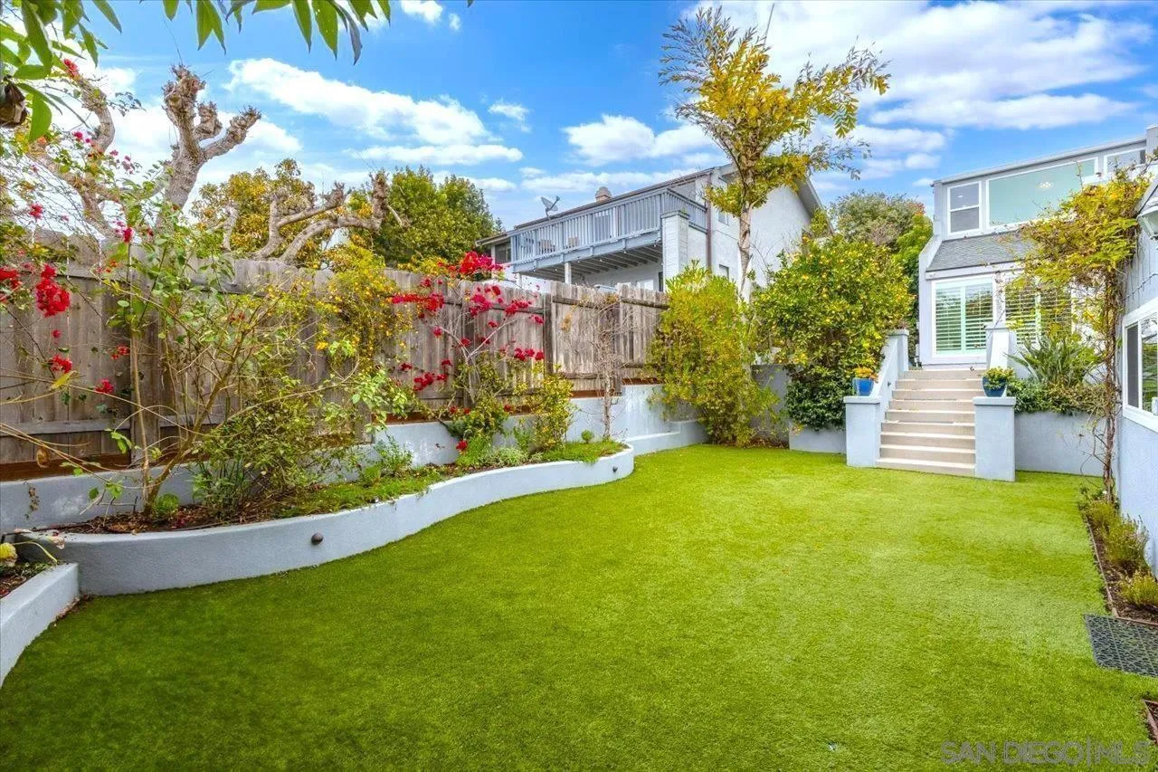 13726 Pine Needles Drive Del Mar, CA 92014 - Photo 53 of 70 a front view of a house with a yard and fountain in middle